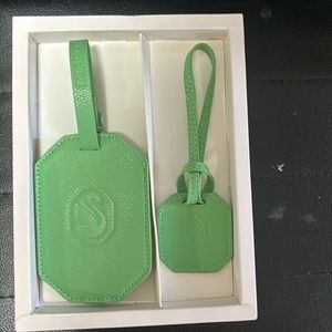 Brand new authentic Swarovski suit case tags